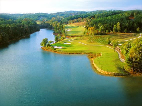 a golf course with a river
